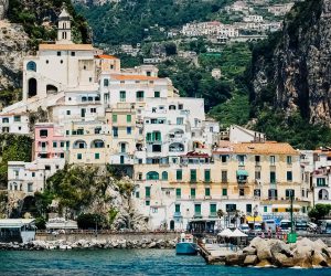Sorrento, Italy - June 5, 2019: View from the sea of this picturesque Italian Mediterranean city, with old and colorful houses built on the side of a hill.